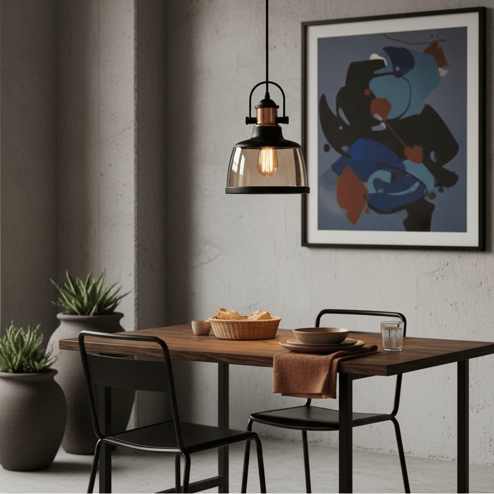 Metal pendant light with cognac glass above a wooden dining table, featuring a modern art piece in the background.