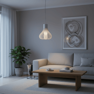 Scandi white pendant light hanging above a modern living room setting with a sofa and coffee table.