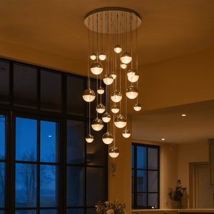 Dining room with a modern chandelier and large windows.