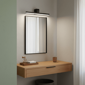 Slim black LED picture light mounted above a mirror on a wooden vanity, illuminating the space with cool white light.