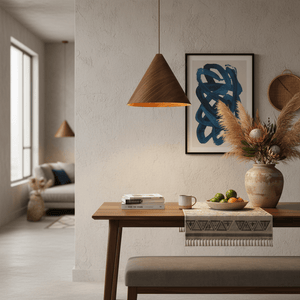 Stylish walnut wood veneer pendant light above a dining table with decorative elements.