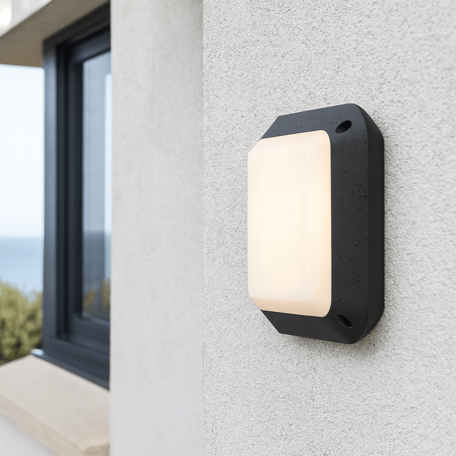 Outdoor wall lights in Cape Town for modern home entrances, realistic South African exterior wall lighting, warm 3000K LED ambience, weather-resistant installation, balanced 800x800 composition with charcoal and warm stone accents