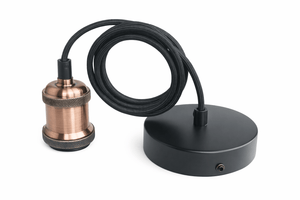 Copper and black lamp parts on a white background