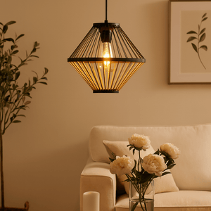 Living room with a pendant light, sofa, coffee table, and decorative elements.