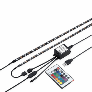 RGB LED strip lights with remote control and power adapter on a white background