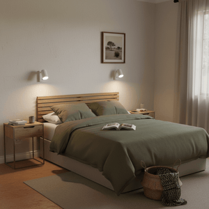 Cozy bedroom with green bedding, wooden headboard, and side tables.