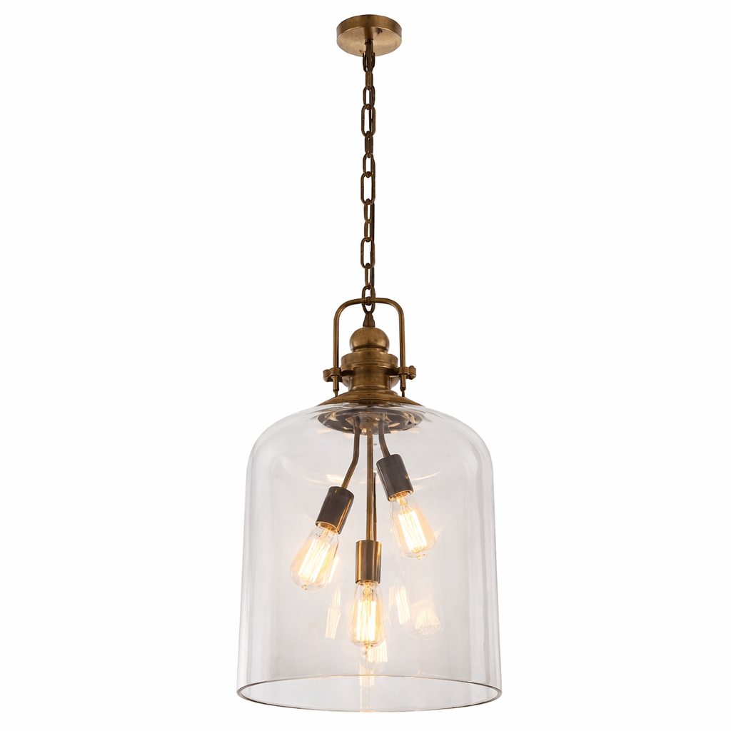 Vintage-style pendant light with clear glass shade and brass fixture on a white background
