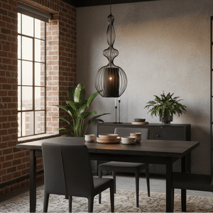 Tokyo 4 Black Wire Frame Pendant light hanging over a modern dining table with chairs and decorative bowls.