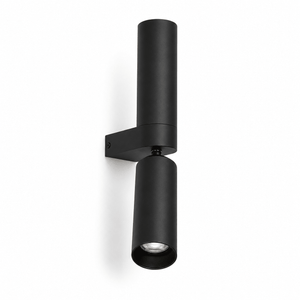 Banyan Black Up & Down Wall Light mounted on a white wall, showcasing its sleek, modern design.