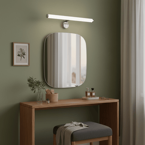 LED mirror light mounted above a modern dressing table with a mirror, plants, and decorative items.