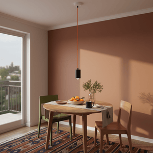 Coiled orange cable on a transparent background