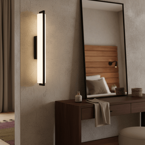 Giada LED Mirror Light mounted beside a large mirror on a textured wall, illuminating a wooden vanity.