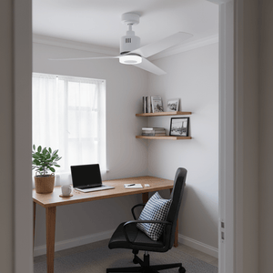 Modern white ceiling fan installed in a bright home office with a desk and plants.