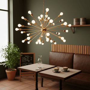 Satin gold pendant light with multiple bulbs hanging above a cozy café table setting.