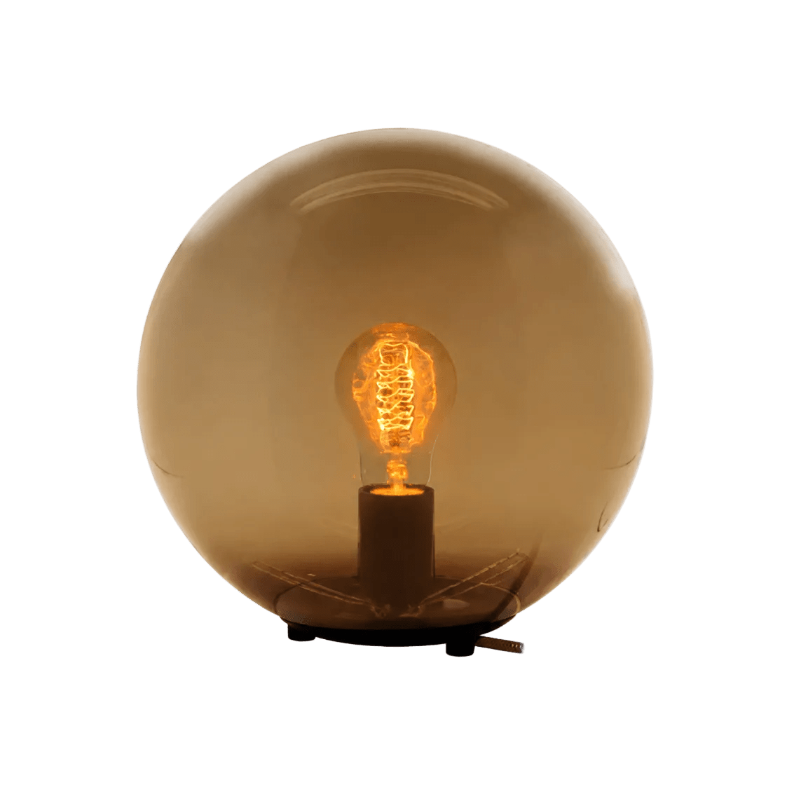 A round, amber glass table lamp with a visible vintage-style bulb inside, resting on a black base.