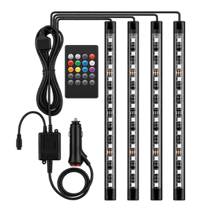 RGB dashboard LED lighting kit with remote, controller and cigarette lighter plug on transparent background