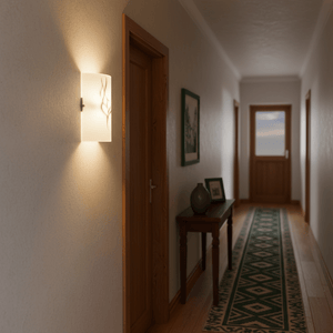 Patterned glass wall bracket illuminating a hallway with wooden doors and a decorative runner.