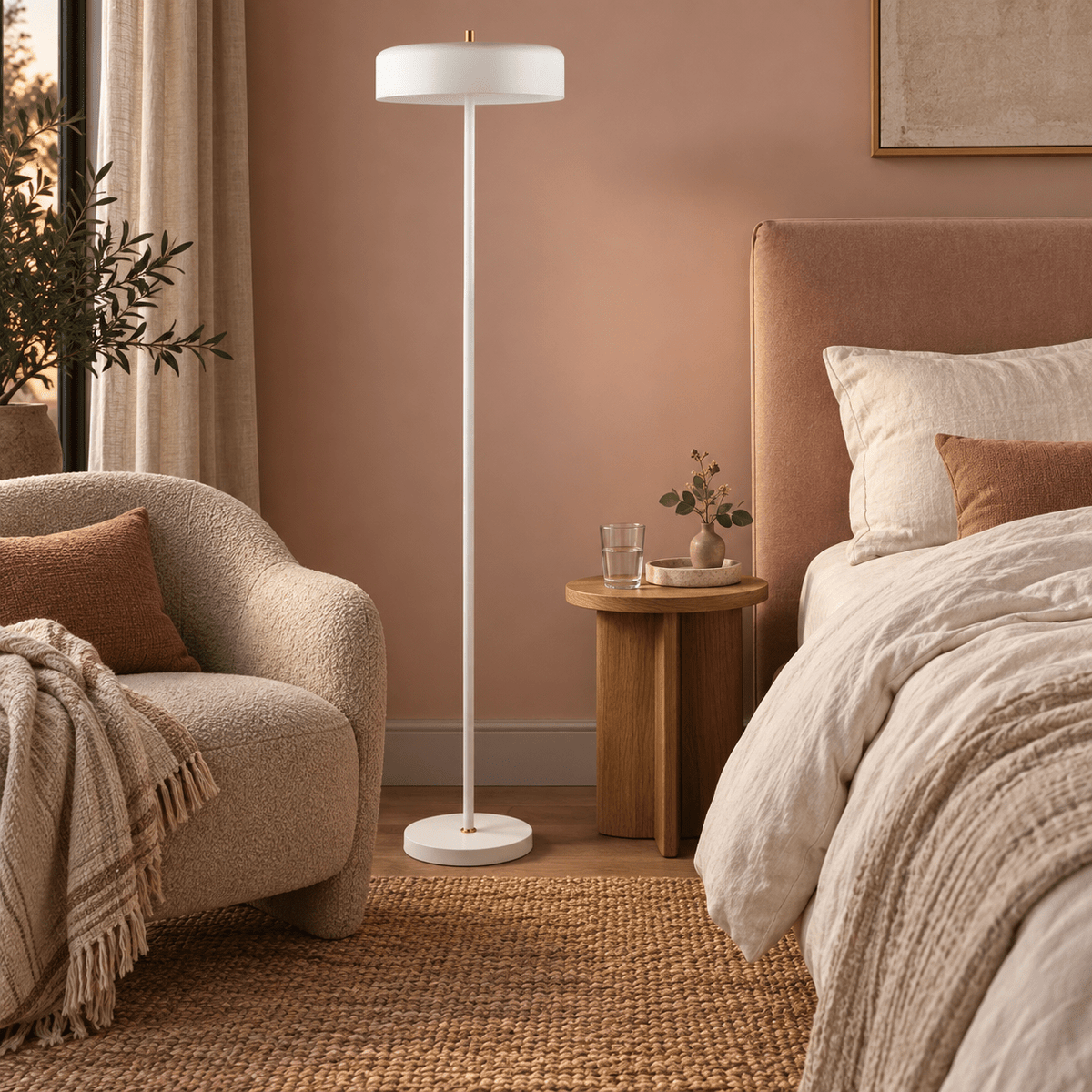 Diaz white floor lamp beside a clay pink bedroom reading chair