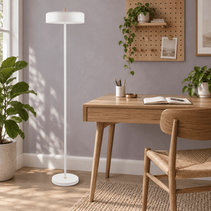 Diaz white floor lamp beside a home office desk