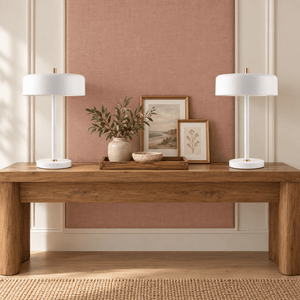 Pair of Diaz white table lamps on a clay pink console