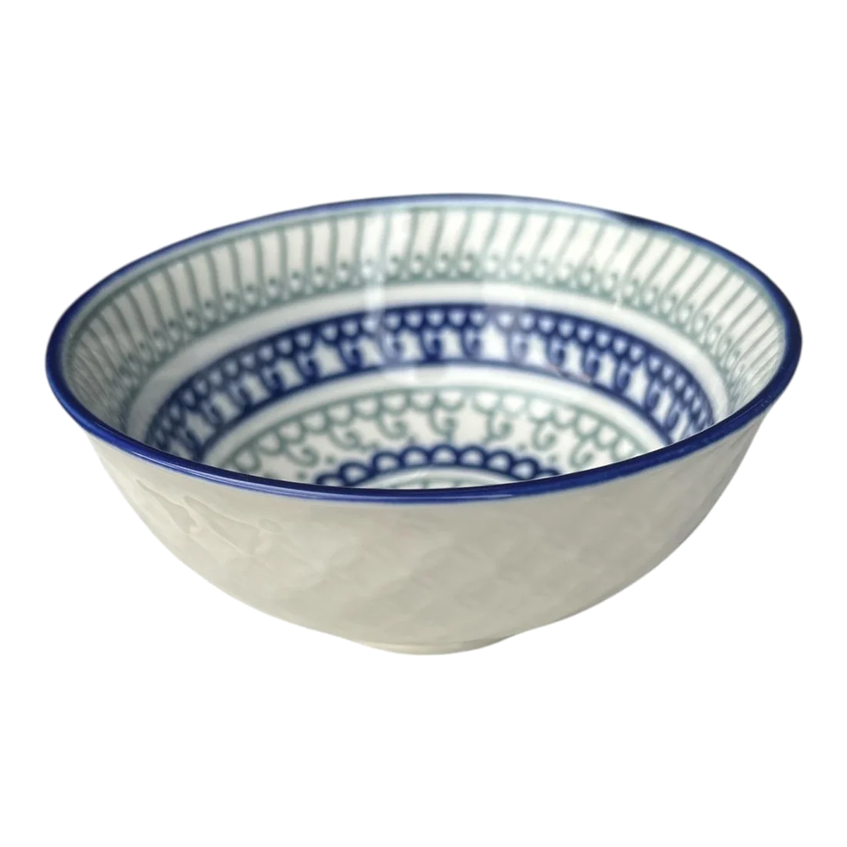 White ceramic bowl with blue rim and green‑blue patterned interior
