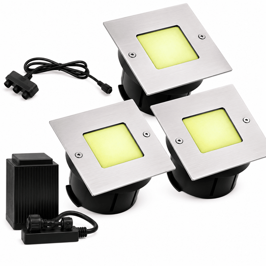 Three square LED deck lights with stainless steel plates and yellow lenses, accompanied by a power supply and connector.