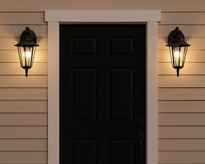 Black front door with sleek outdoor lighting fixtures on a beige house exterior.