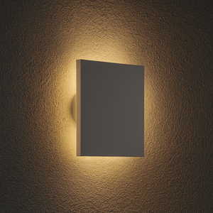 Modern square backlit LED wall light casting a soft glow on a textured wall.