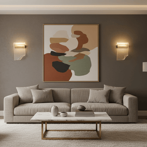 Gold Wave LED Wall Light illuminating a contemporary living room with abstract artwork.