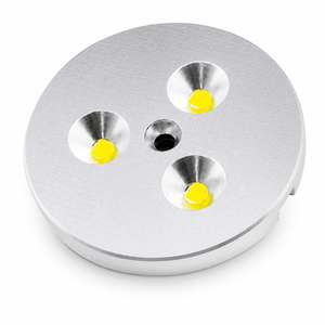 Three LED puck lights with yellow bulbs in a circular silver housing.