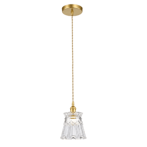 A gold ceiling mount supports a long twisted cord leading to a fluted clear glass pendant light.