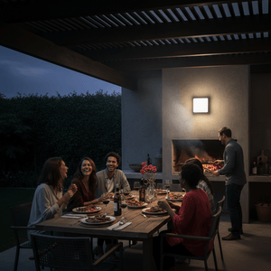 Outdoor scene featuring a group enjoying dinner under a covered patio, illuminated by a square wall light.