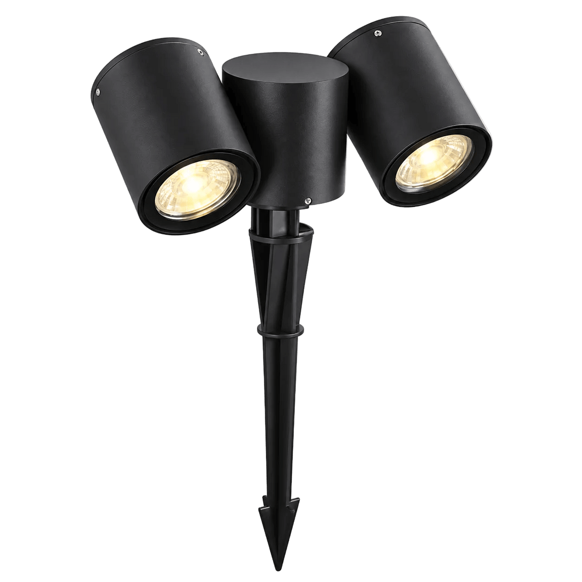Black dual‑head outdoor spike light with two adjustable heads on a pointed stake, illuminated, against green background.