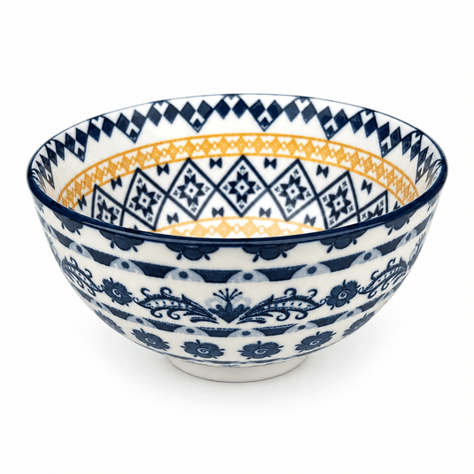 Mini ceramic bowl featuring orange and blue diamond patterns, showcasing intricate designs and a glossy finish.
