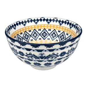 Mini ceramic bowl featuring orange and blue diamond patterns, with a glossy white finish and decorative floral designs.