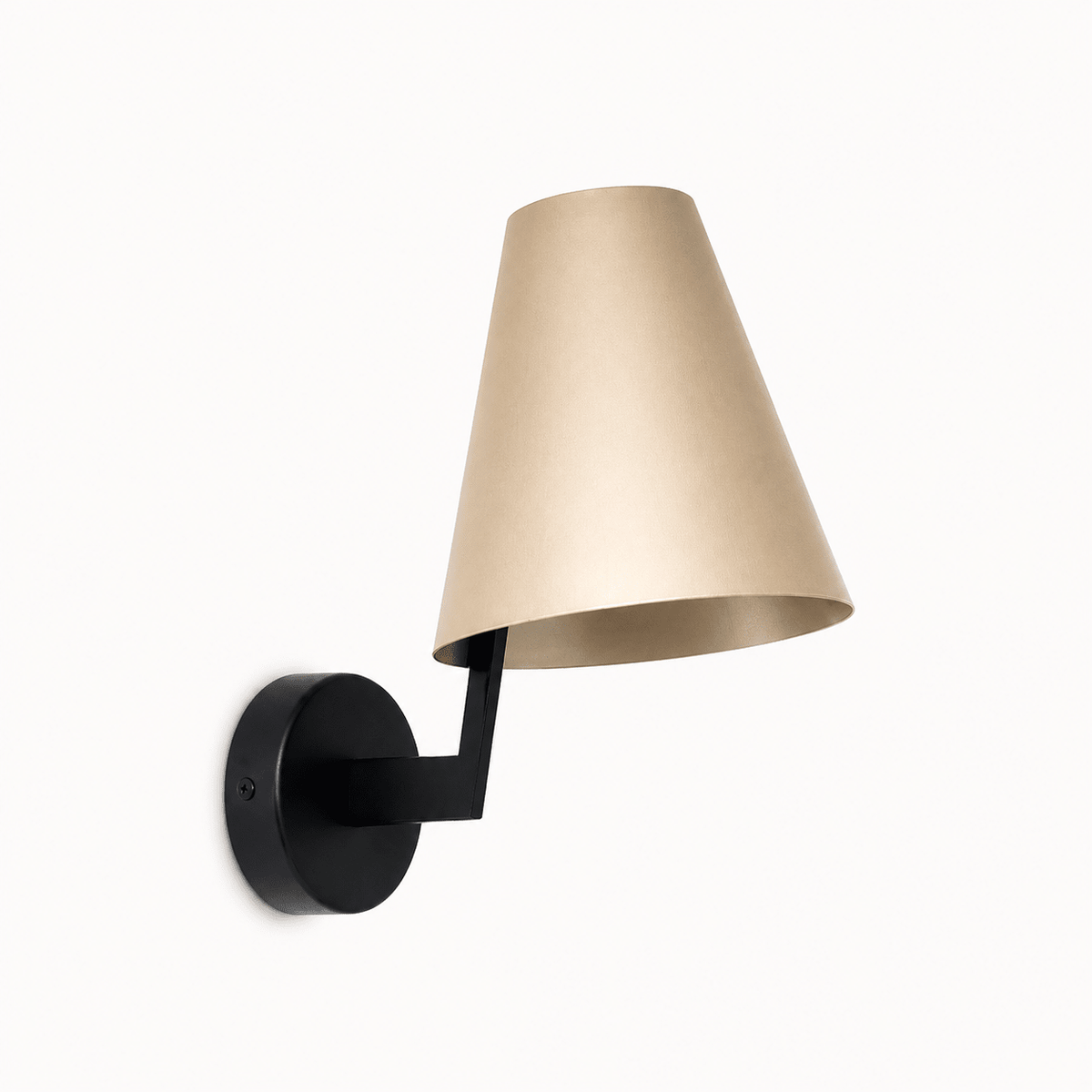 Contemporary indoor wall light with a gold shade and black mount, casting a warm glow.