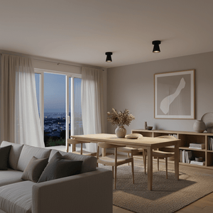 Stylish living room featuring Kiddush surface-mounted downlights illuminating a wooden dining table.