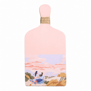 Light pink wooden figurine featuring a scenic illustration of two people enjoying a beach view.