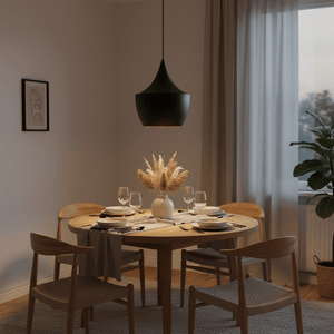 Miso Nordic Pendant Light hanging above a round dining table set with plates and glasses, featuring a floral centerpiece.
