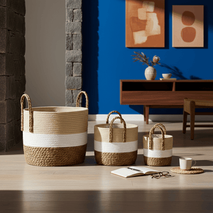 Woven storage basket set in natural, white, and brown displayed in a stylish living room setting.