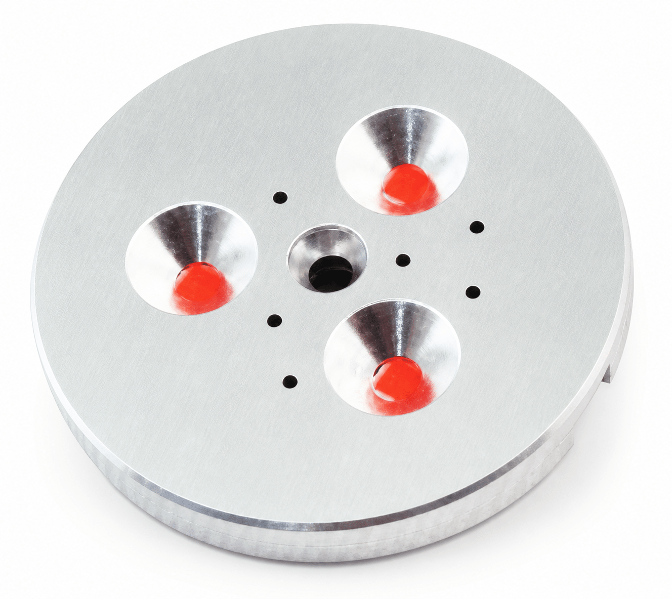 Three LED puck lights with red lenses on a silver circular base