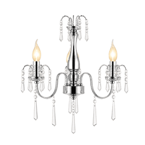 Three-arm crystal chandelier with a polished chrome finish, featuring candle-like bulbs and hanging crystal accents.