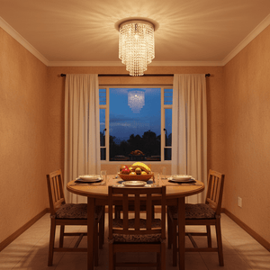 A stylish round ceiling light with K9 crystals illuminating a dining table set with fruit and tableware.