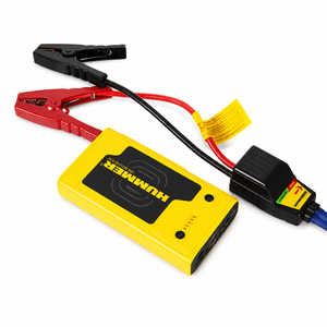 Hummer HX Pro 12V jump starter with red and black clamps connected, showcasing its compact design.
