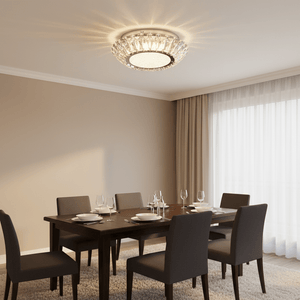 Flush ceiling light with crystal detailing illuminating a dining area with a wooden table and chairs.