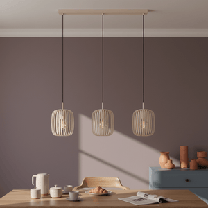Sandy 3-Light Pendant Light above a dining table, featuring three woven shades and a modern design.