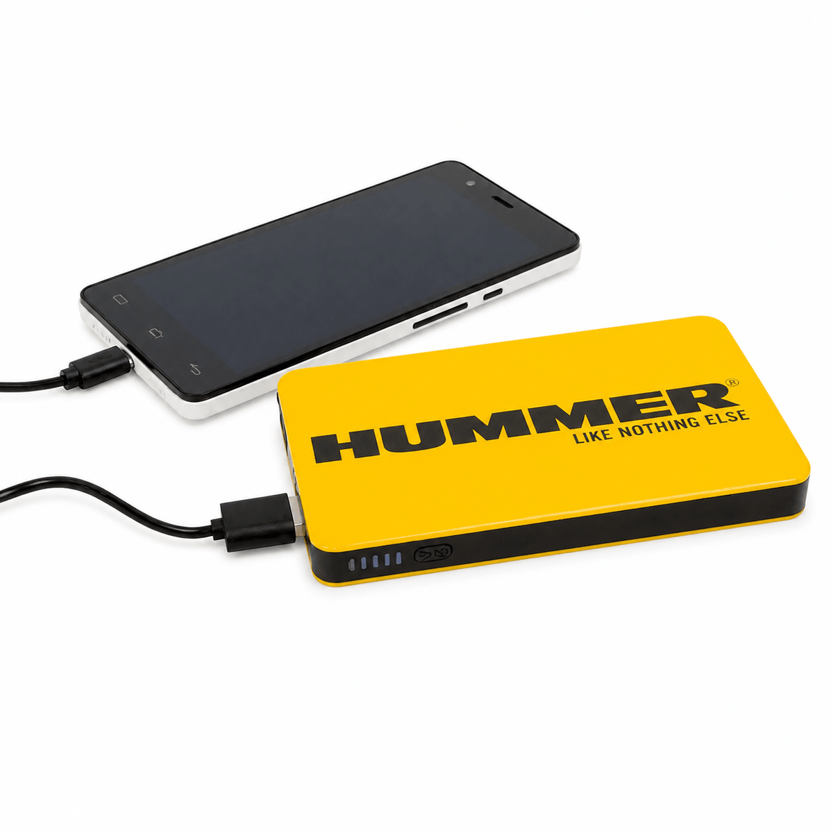 Compact yellow jump starter connected to a smartphone, showcasing charging capability.
