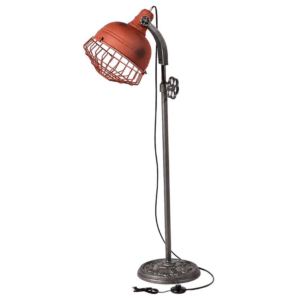 A rustic floor lamp with a red metal shade and wire cage, mounted on a decorative silver base.