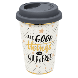 White ceramic travel mug with grey lid, black dot pattern, gold stars, gold trim, and 'ALL GOOD things are WILD & FREE'