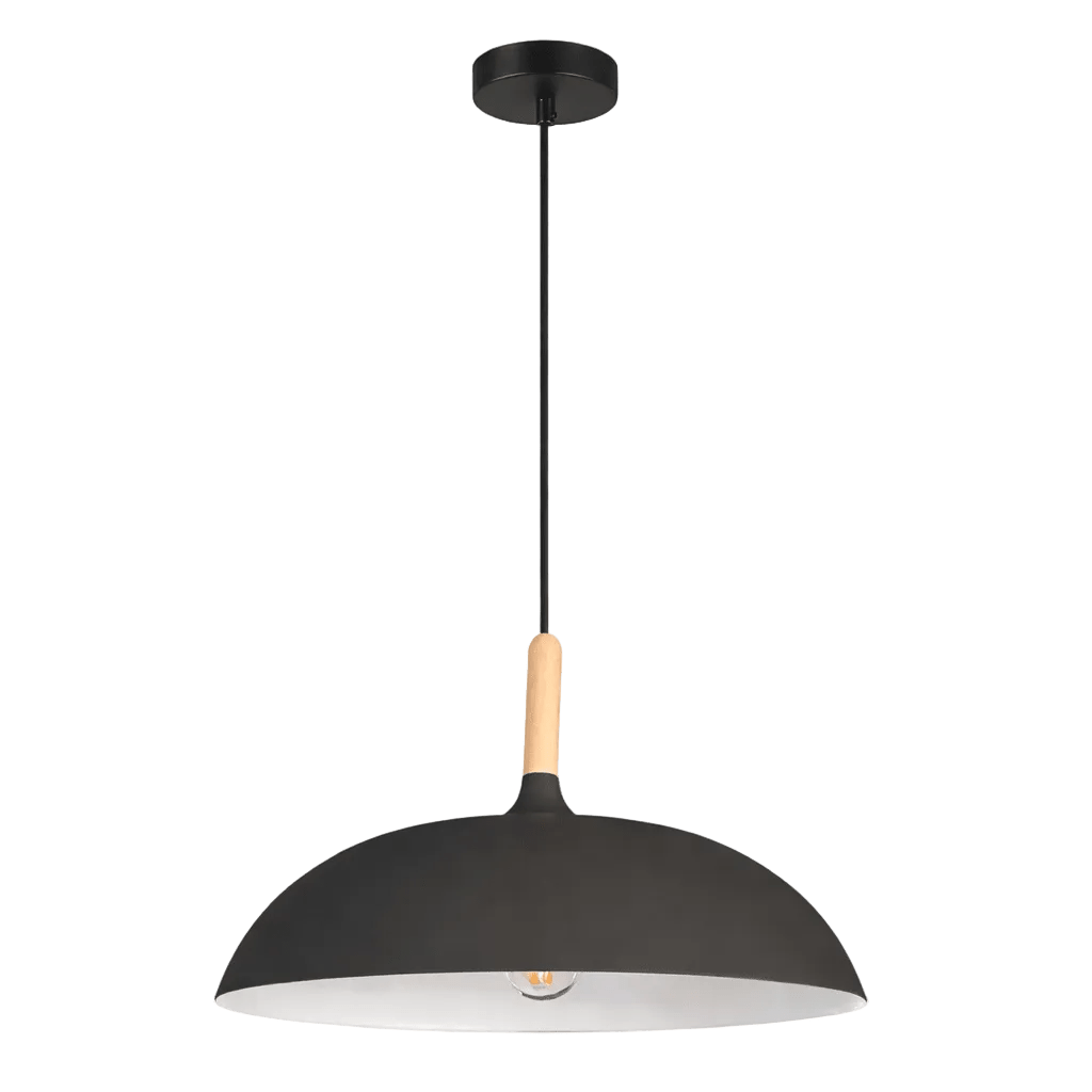 Black pendant light with wooden knob, black dome shade and white interior, hanging against a green background.